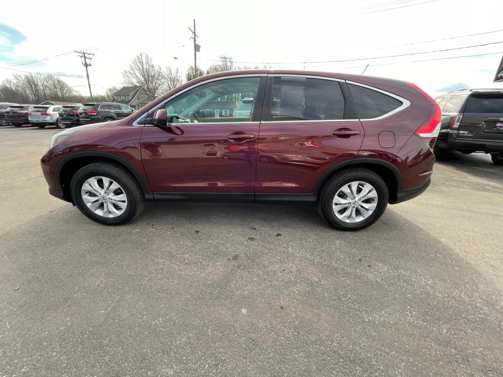 2014 Red /Gray Honda CR-V EX 4WD 5-Speed AT (5J6RM4H59EL) with an 2.4L I4 DOHC 16V engine, 5-Speed Automatic transmission, located at 547 E. Main St., Orwell, OH, 44076, (440) 437-5893, 41.535435, -80.847855 - This 2014 Honda CR-V AWD EX with a 2.4L engine and 5-speed automatic transmission offers a balanced blend of comfort, reliability, and efficiency. Equipped with ECO mode, it optimizes fuel efficiency, making it a budget-friendly option for those conscious of fuel consumption. The addition of a backu - Photo #11
